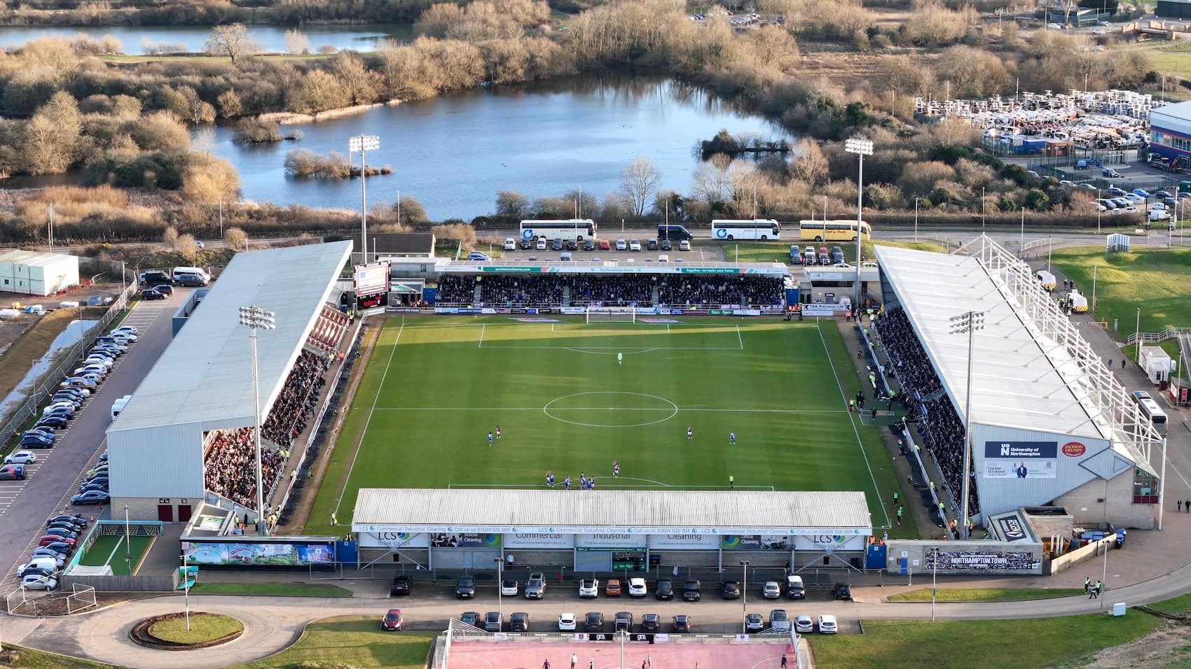 Aerial drone view of Northampton Town FC stadium during a match