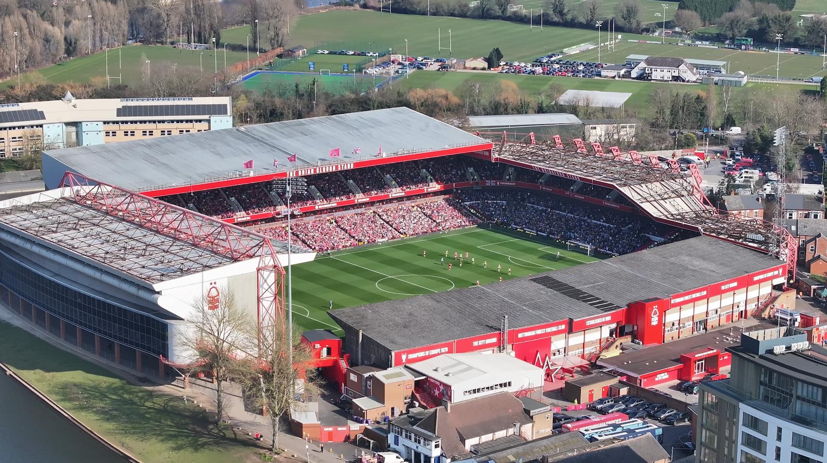 Aerial drone view of a football stadium — live sports transmission capability